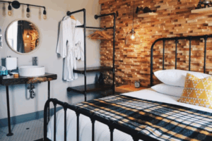 Room 19: King bed with custom wall and live edge black walnut vanity