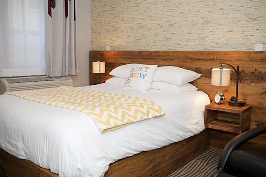 Room 1: The Ultimate Crashpad, queen bed